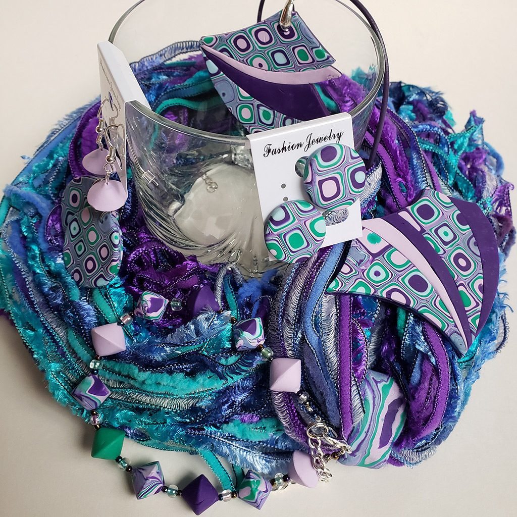 Scarf and a jewelry mix: earrings, necklace, and a brooch